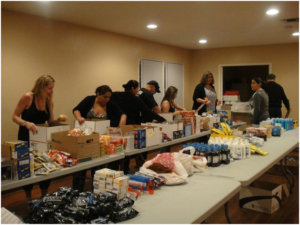 DarrasLaw and Girl Scouts prepare packages for soldiers in Afghanistan